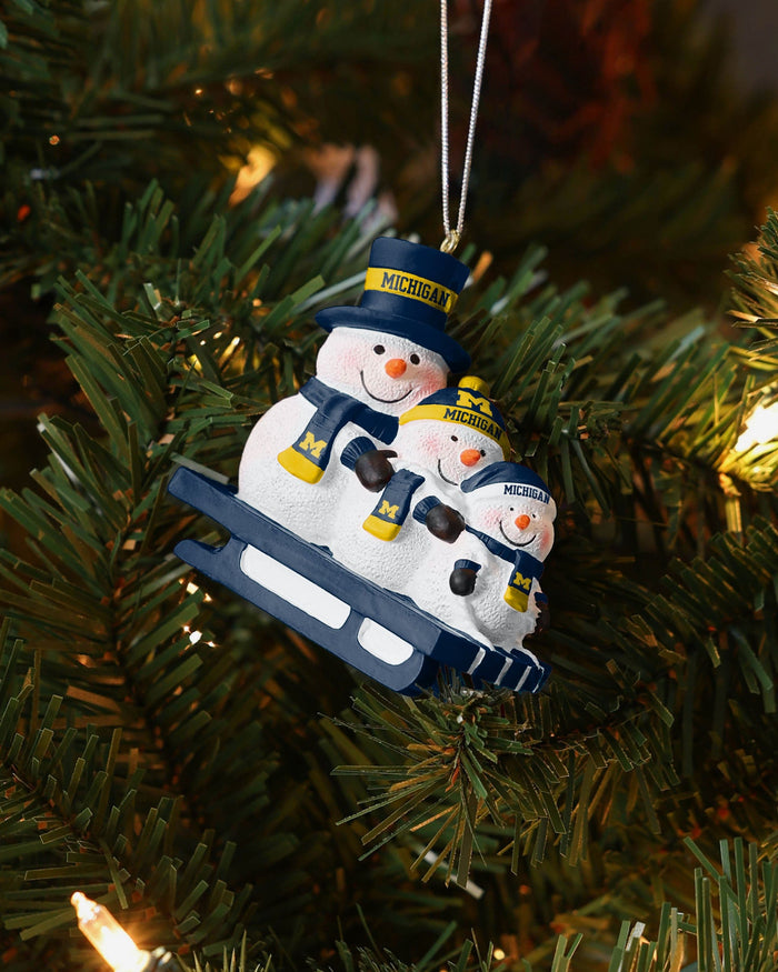 Michigan Wolverines Sledding Snowmen Ornament FOCO - FOCO.com