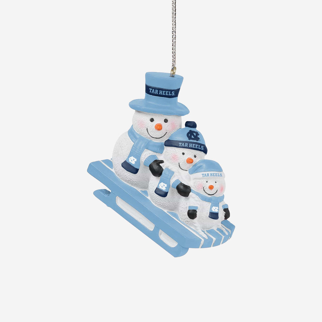 North Carolina Tar Heels Sledding Snowmen Ornament FOCO - FOCO.com