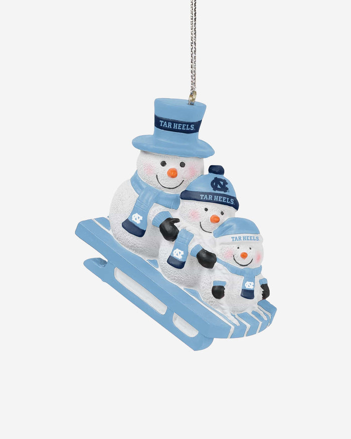 North Carolina Tar Heels Sledding Snowmen Ornament FOCO - FOCO.com