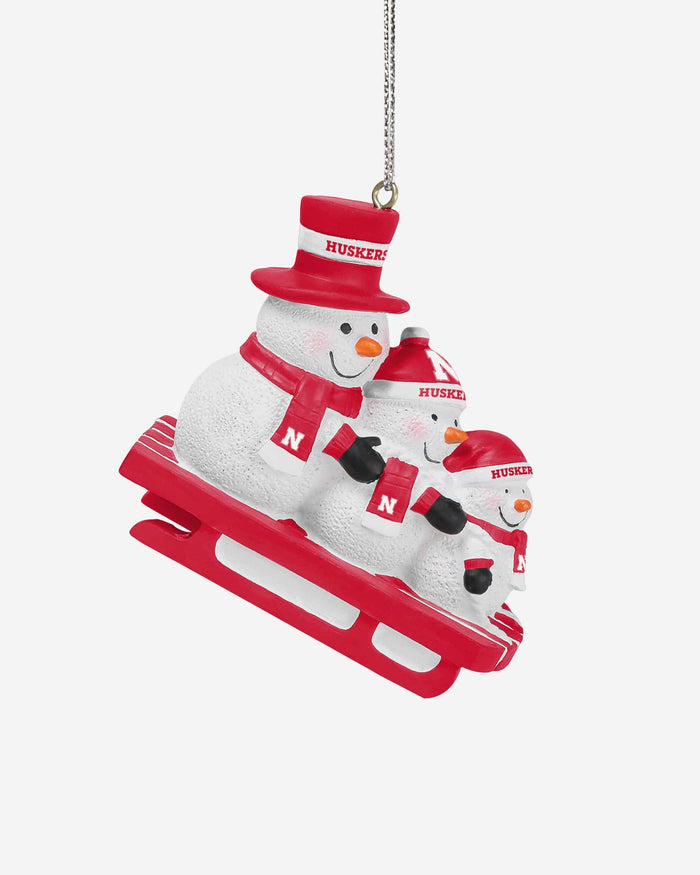 Nebraska Cornhuskers Sledding Snowmen Ornament FOCO - FOCO.com