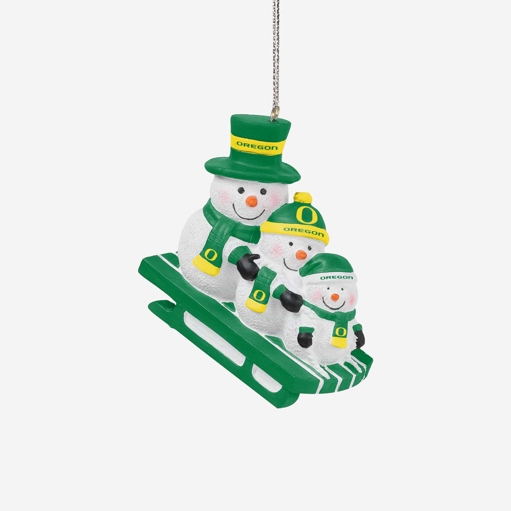 Oregon Ducks Sledding Snowmen Ornament FOCO - FOCO.com