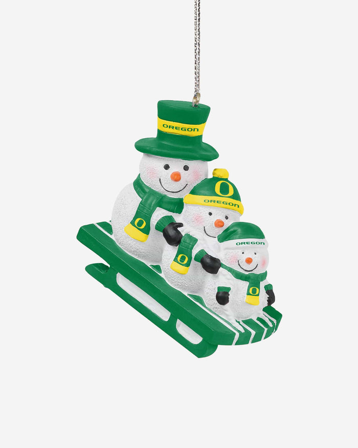 Oregon Ducks Sledding Snowmen Ornament FOCO - FOCO.com
