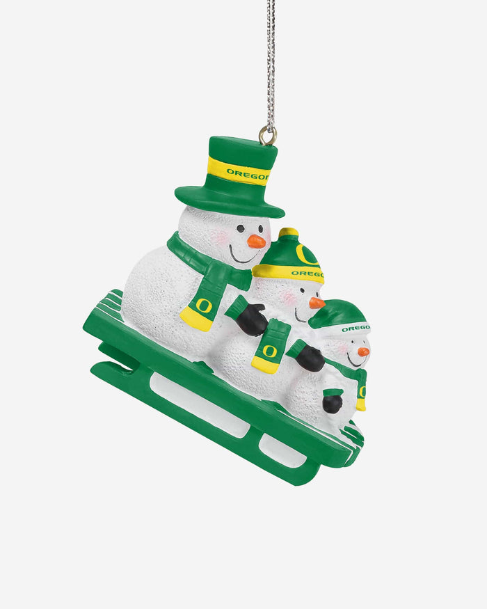 Oregon Ducks Sledding Snowmen Ornament FOCO - FOCO.com