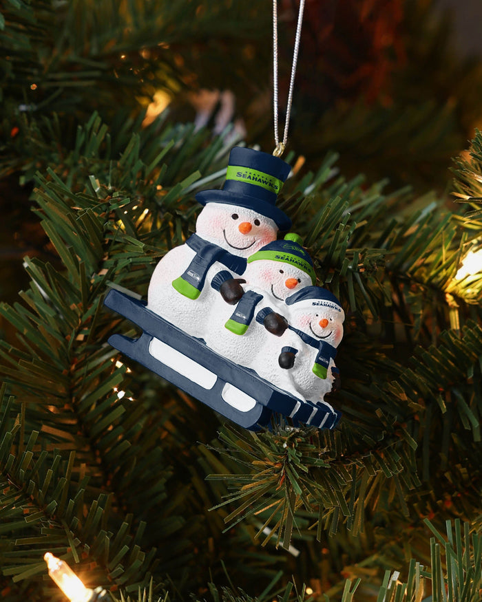 Seattle Seahawks Sledding Snowmen Ornament FOCO - FOCO.com